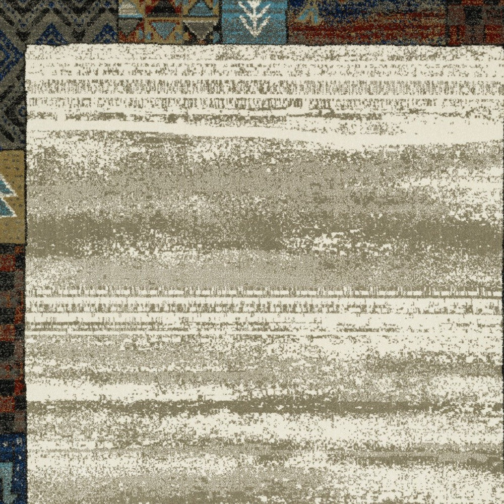 10' X 13' Ivory Tan And Blue Patchwork Area Rug
