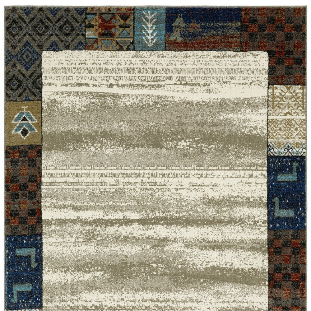 10' X 13' Ivory Tan And Blue Patchwork Area Rug
