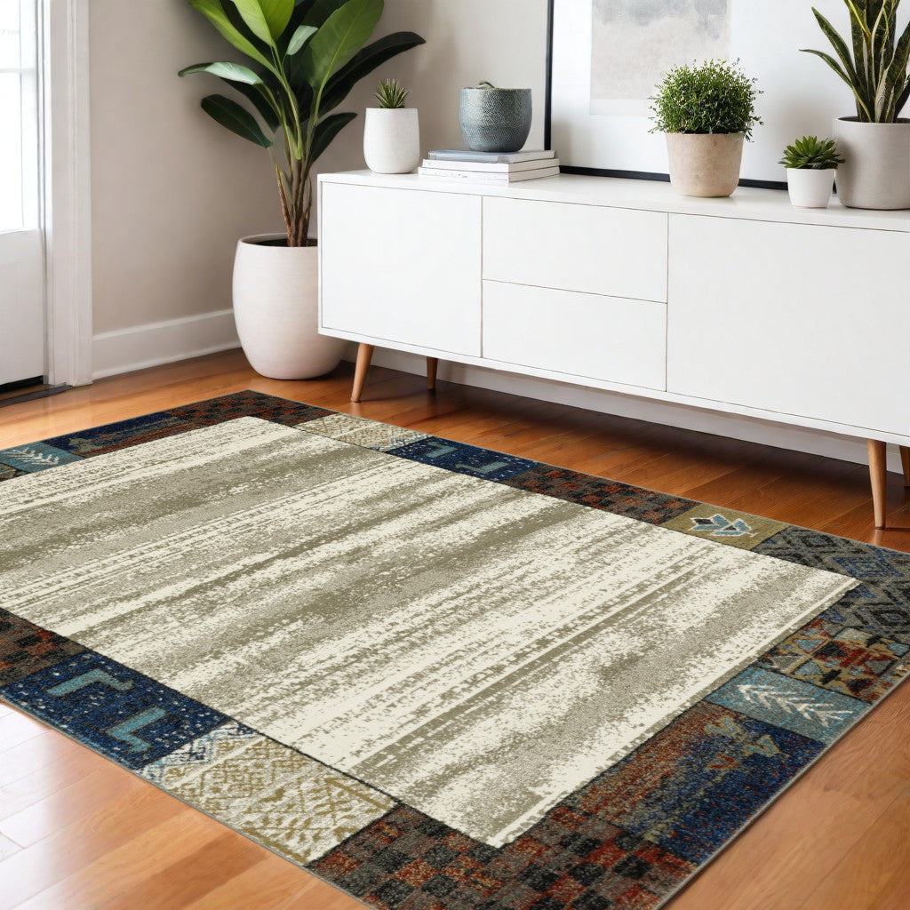 10' X 13' Ivory Tan And Blue Patchwork Area Rug