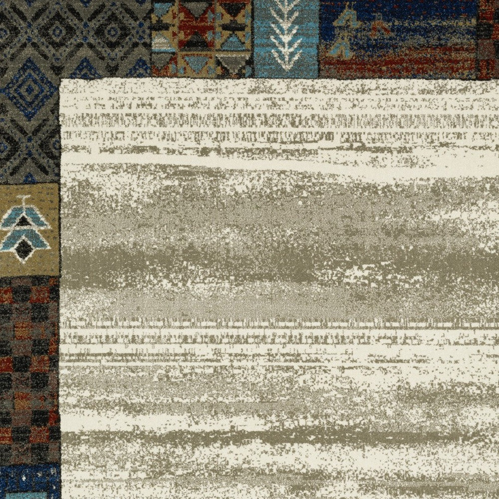 10' X 13' Ivory Tan And Blue Patchwork Area Rug