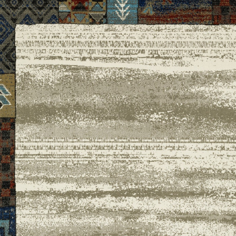 10' X 13' Ivory Tan And Blue Patchwork Area Rug