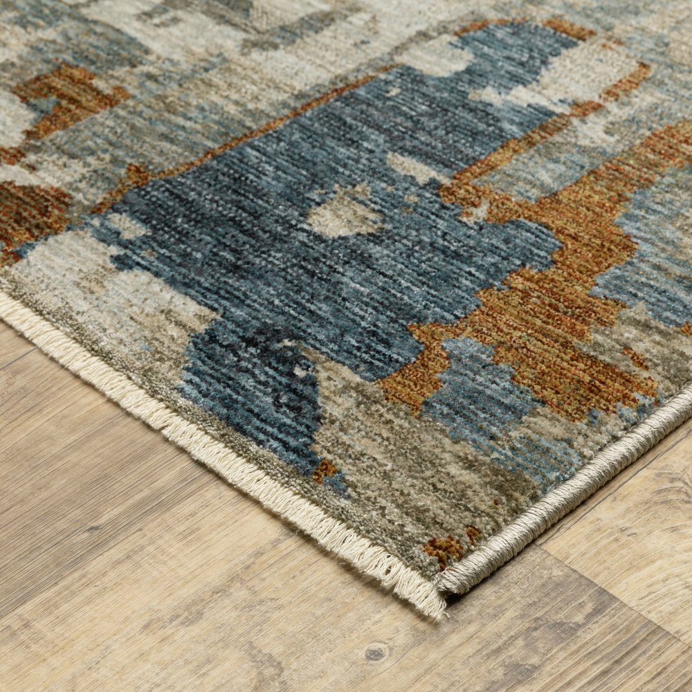 10' X 13' Beige Rust And Teal Abstract Distressed Area Rug With Fringe