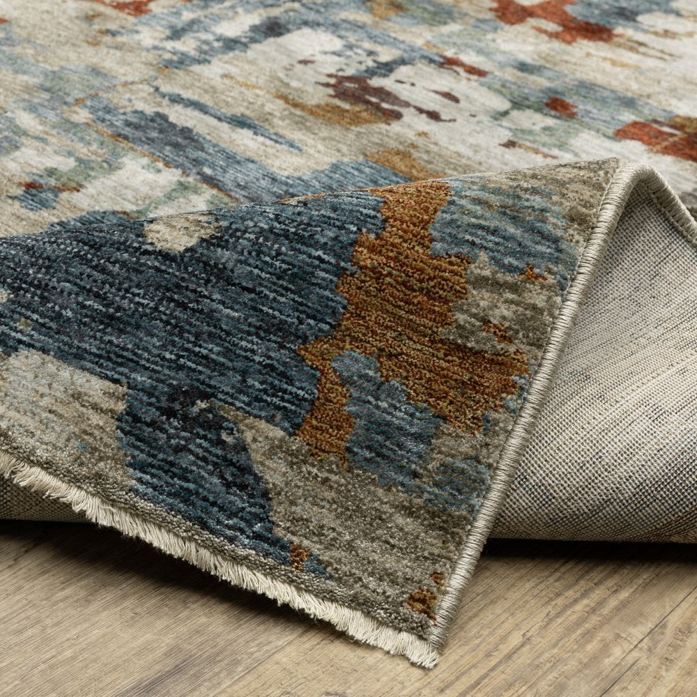 10' X 13' Beige Rust And Teal Abstract Distressed Area Rug With Fringe