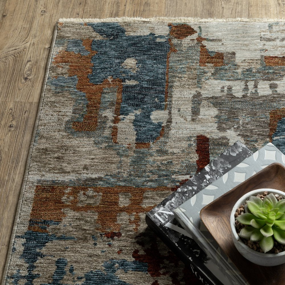 10' X 13' Beige Rust And Teal Abstract Distressed Area Rug With Fringe