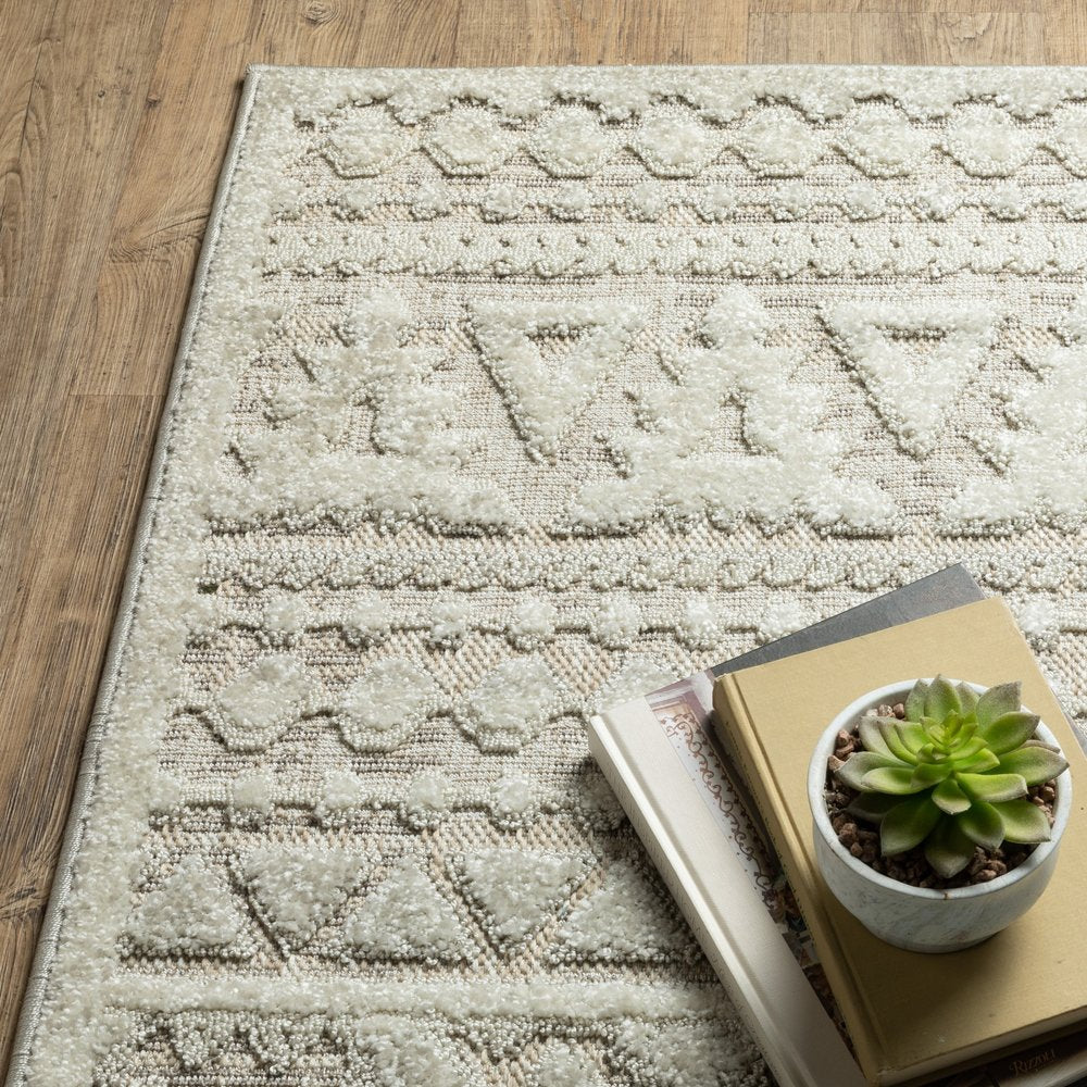 5' X 8' Beige And Ivory Tribal Area Rug