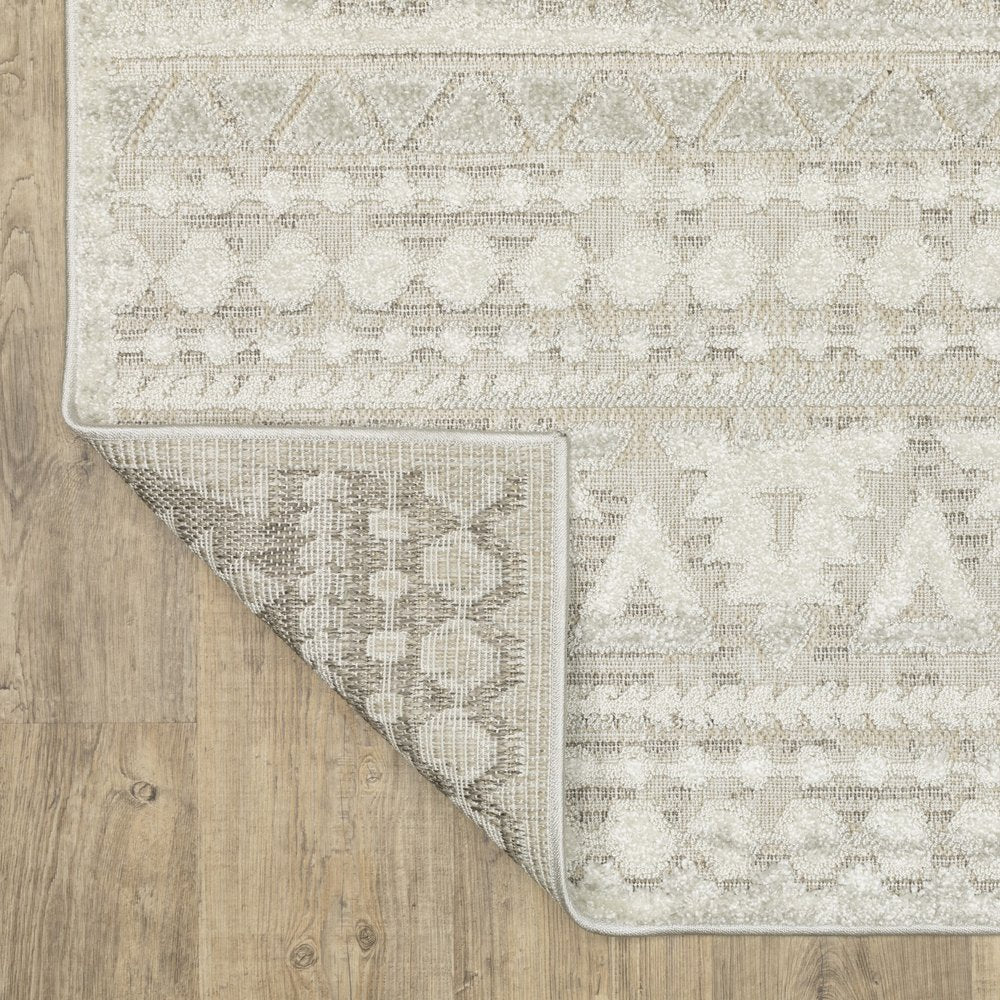 5' X 8' Beige And Ivory Tribal Area Rug