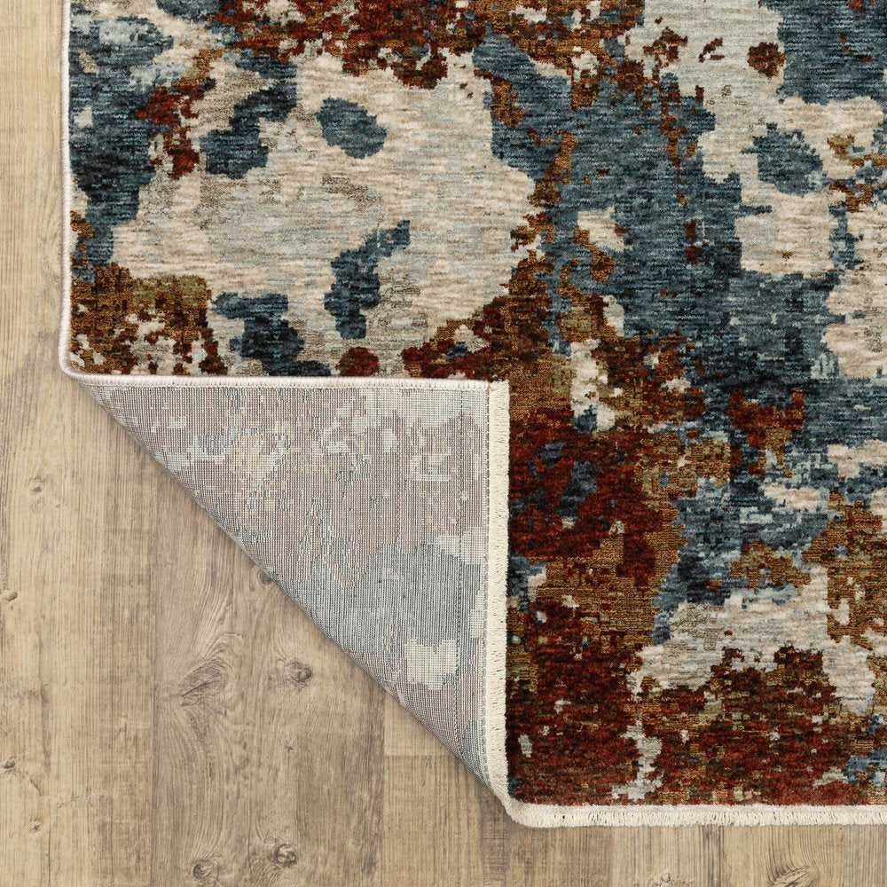 5' X 8' Beige Rust And Teal Abstract Distressed Area Rug With Fringe