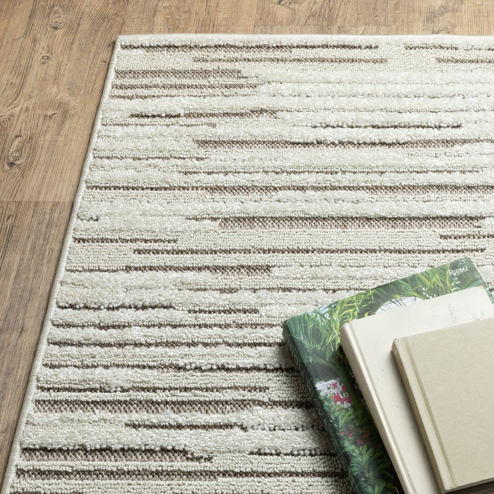 8' X 11' Ivory And Brown Striped Distressed Area Rug
